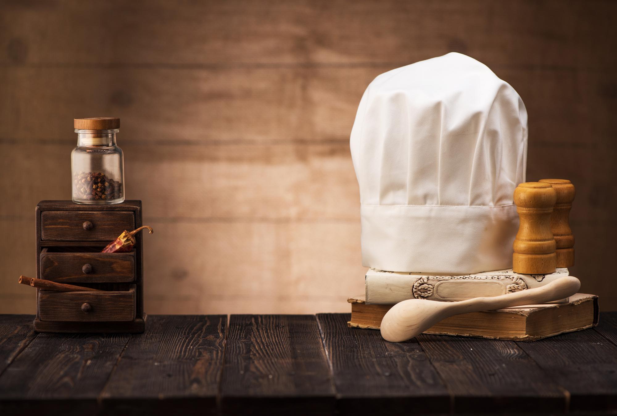 Studio kitchen with chef and wooden table